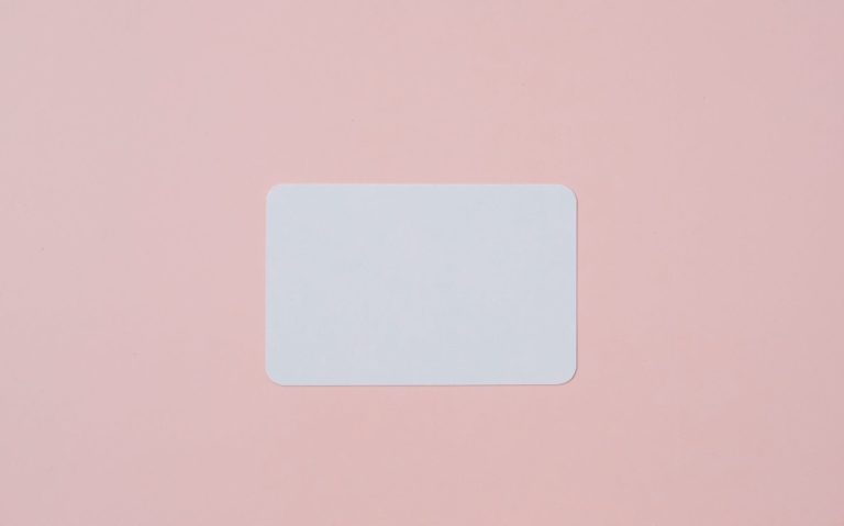 blank visiting card on pink background